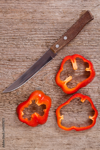 sliced red bell peppers and old knife