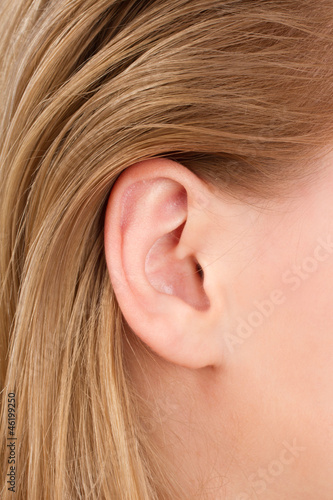 blonde woman ear closeup 