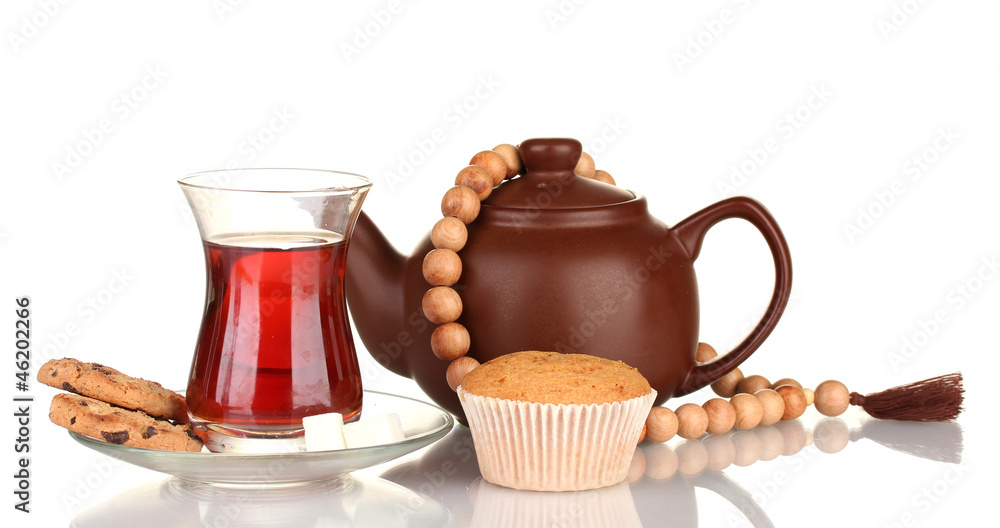 glass of Turkish tea and kettle isolated on white glass of Turkish tea and kettle isolated on white