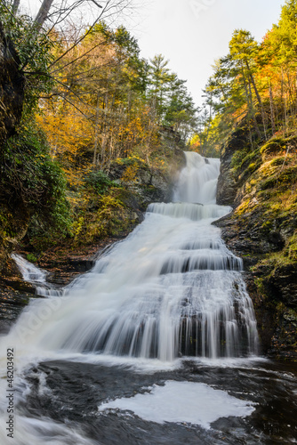 beautiful waterfall in forest  autumn landscape
