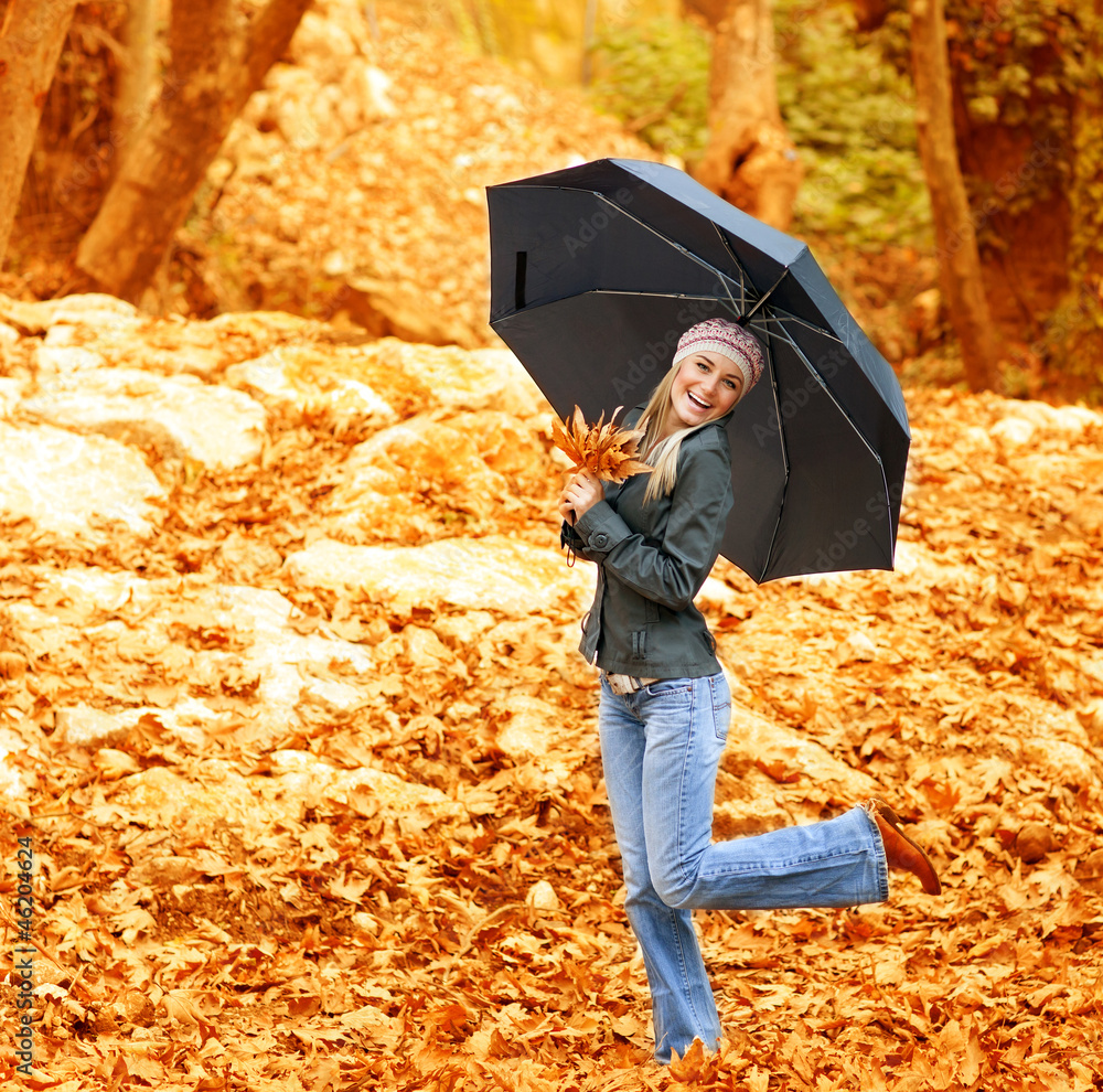Fotografie Happy female dancing with parasol