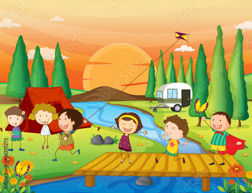 a river, a bench and kids