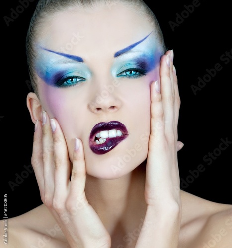 Portrait of pretty young woman with  bright makeup