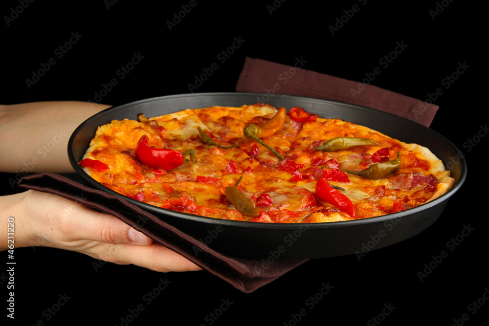 hands holding pepperoni pizza in pan isolated on black hands holding pepperoni pizza in pan isolated on black