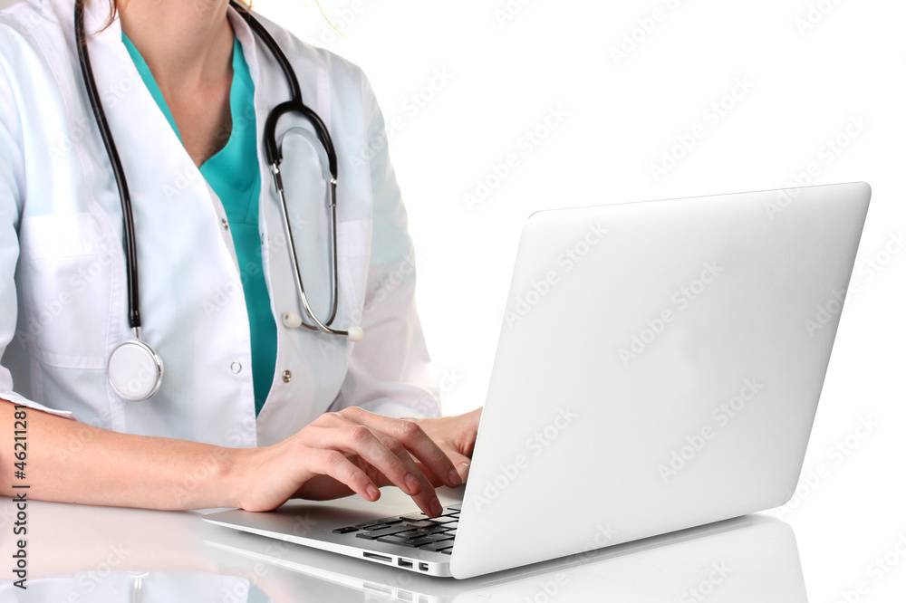 Doctor using laptop computer isolated on white Doctor using laptop computer isolated on white