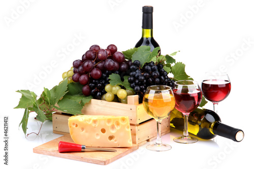 bottles and glasses of wine  assortment of grapes and cheese