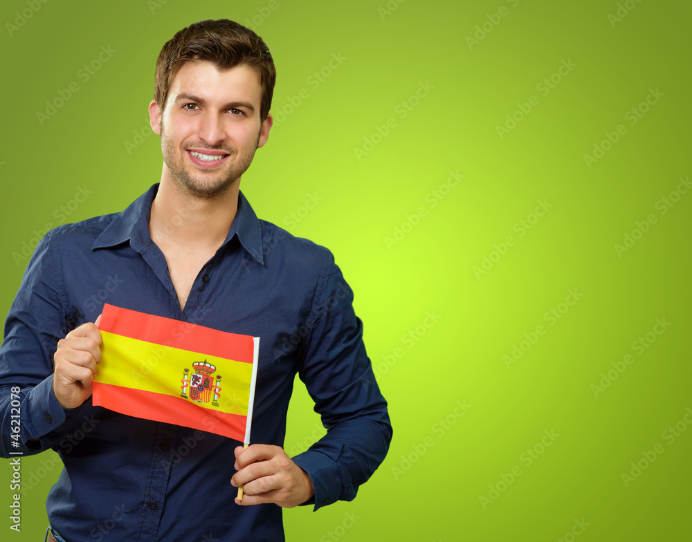 A Young Man Holding A Spain Flag A Young Man Holding A Spain Flag