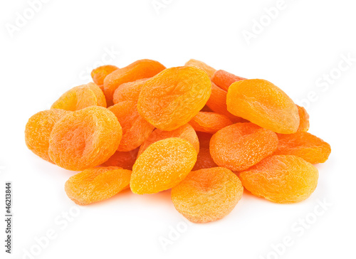 A handful of dried apricots isolated on white background