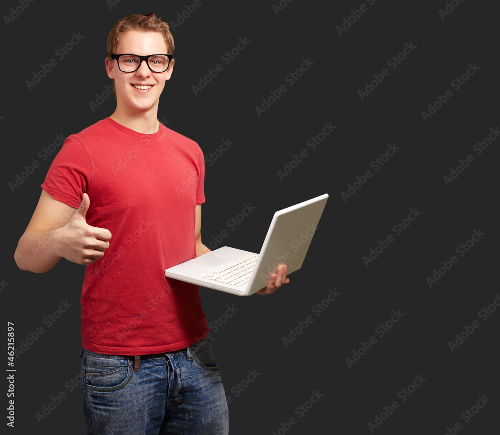 Man holding laptop with thumbs up Man holding laptop with thumbs up