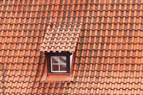 Tile roof with a window as a background