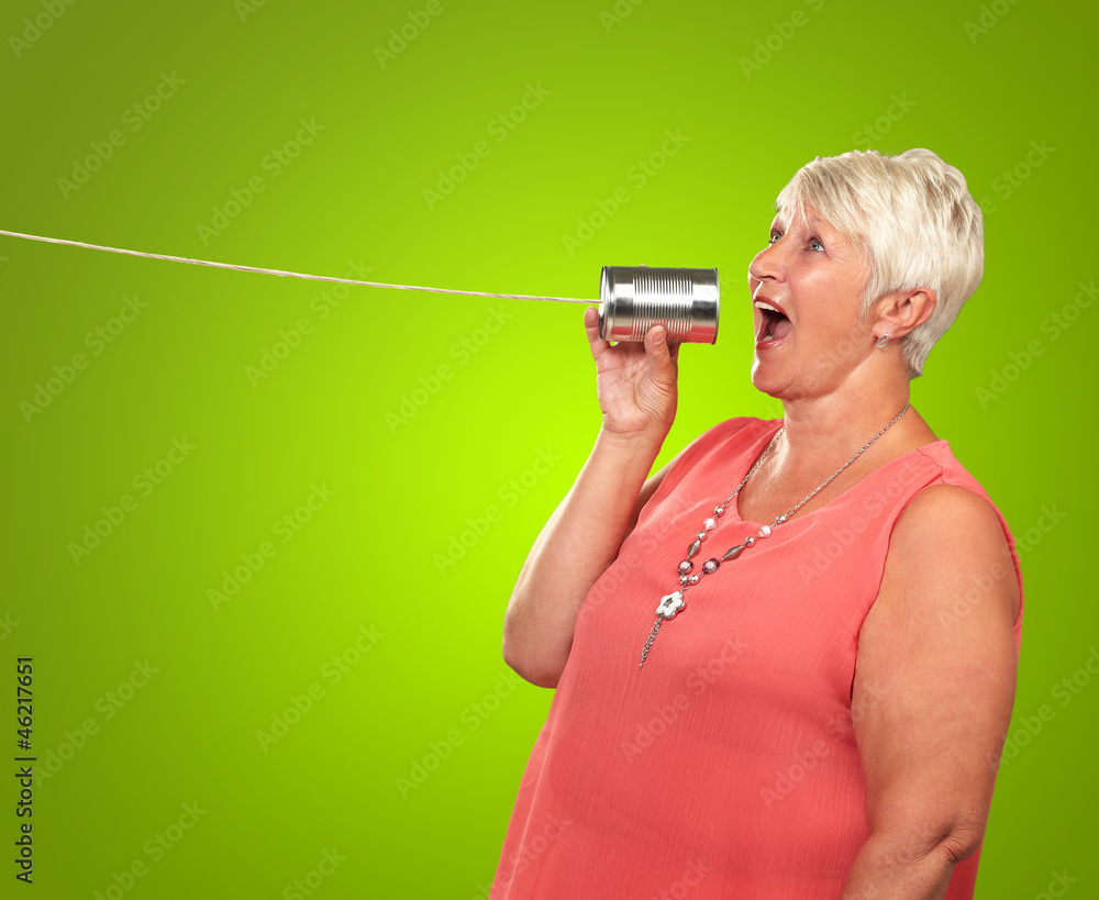 Senior Woman Communicating With Tin Can Phone Senior Woman Communicating With Tin Can Phone