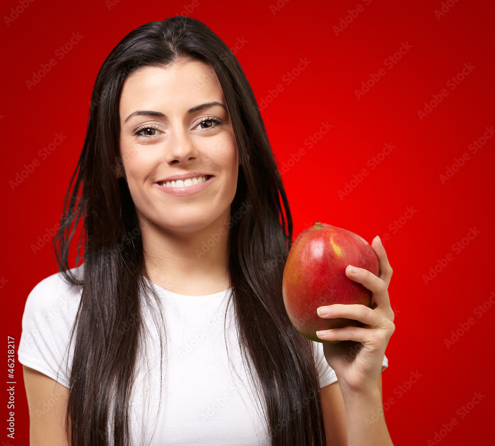 A Young Woman Holding A Mango A Young Woman Holding A Mango