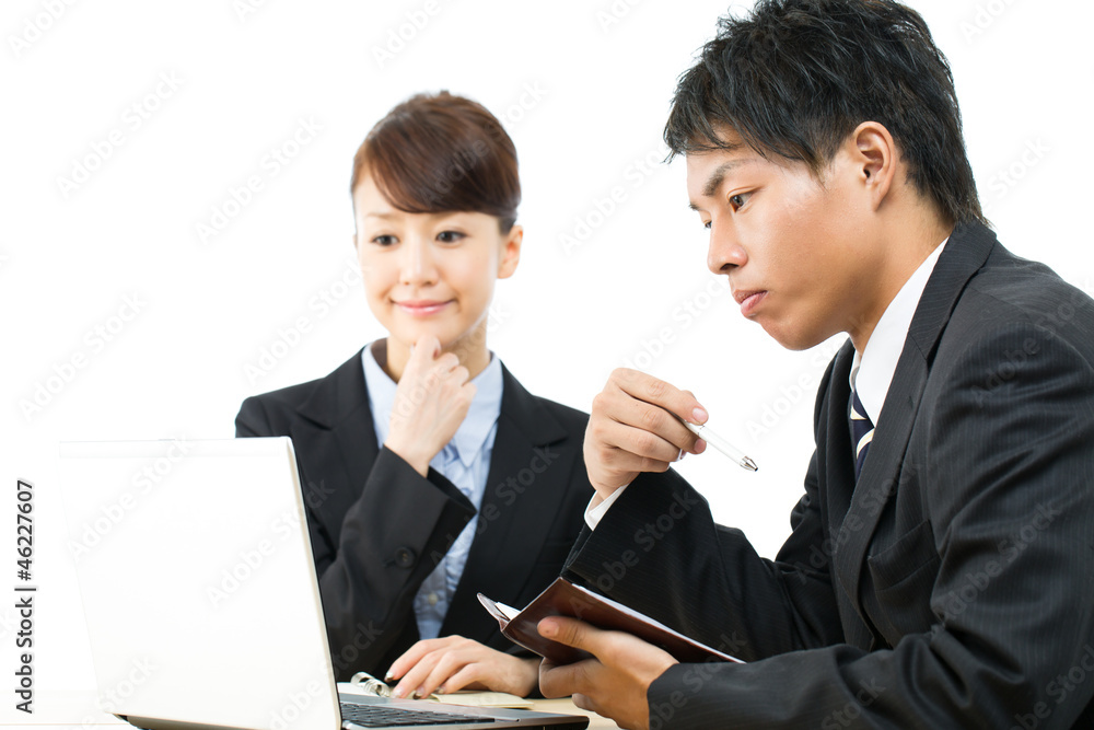Young asian smiling business woman and businessman Young asian smiling business woman and businessman