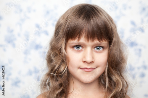 Принти на полотні Portrait of sincere young grey-eyed girl child looking at camera