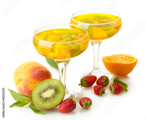 punch in glasses with fruits  isolated on white