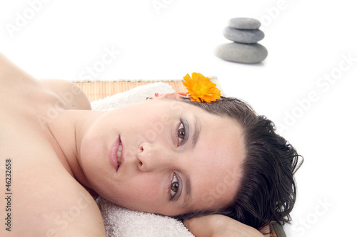 attractive woman with hot stones treatment at a spa