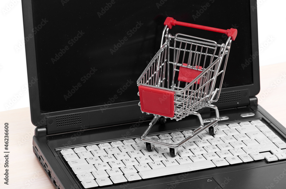 Online shopping. trolley on laptop