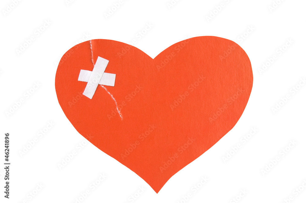 Broken heart concept: paper heart torn and fixed with plaster Broken heart concept: paper heart torn and fixed with plaster