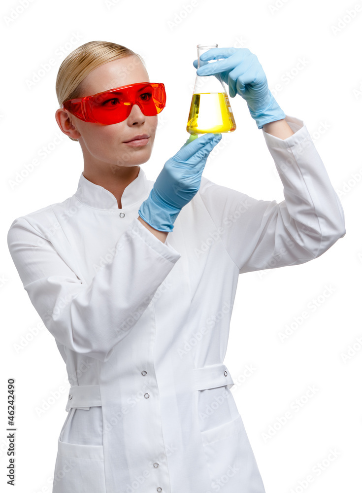 Woman doctor hands Erlenmeyer flask with yellow water Woman doctor hands Erlenmeyer flask with yellow water