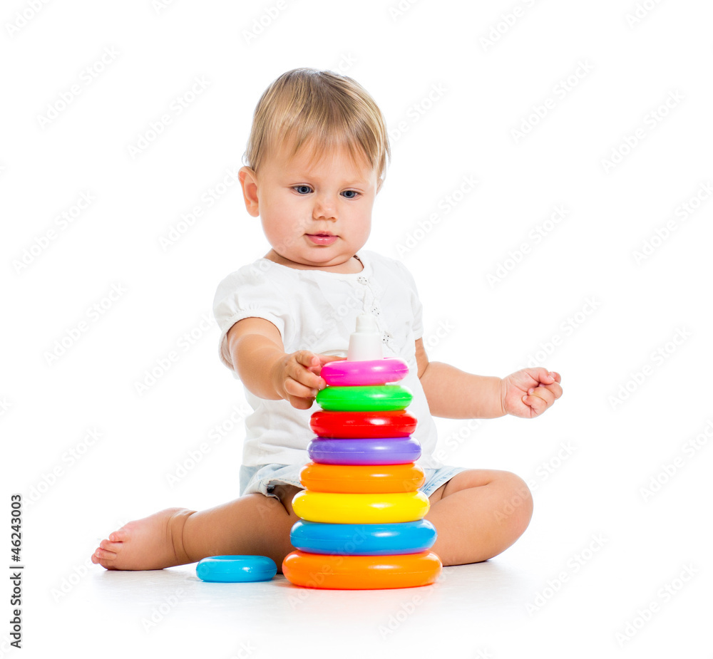 Obraz premium adorable baby playing with color toy