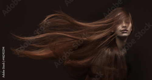 Fotografie, Obraz beautiful woman with long hair on dark background