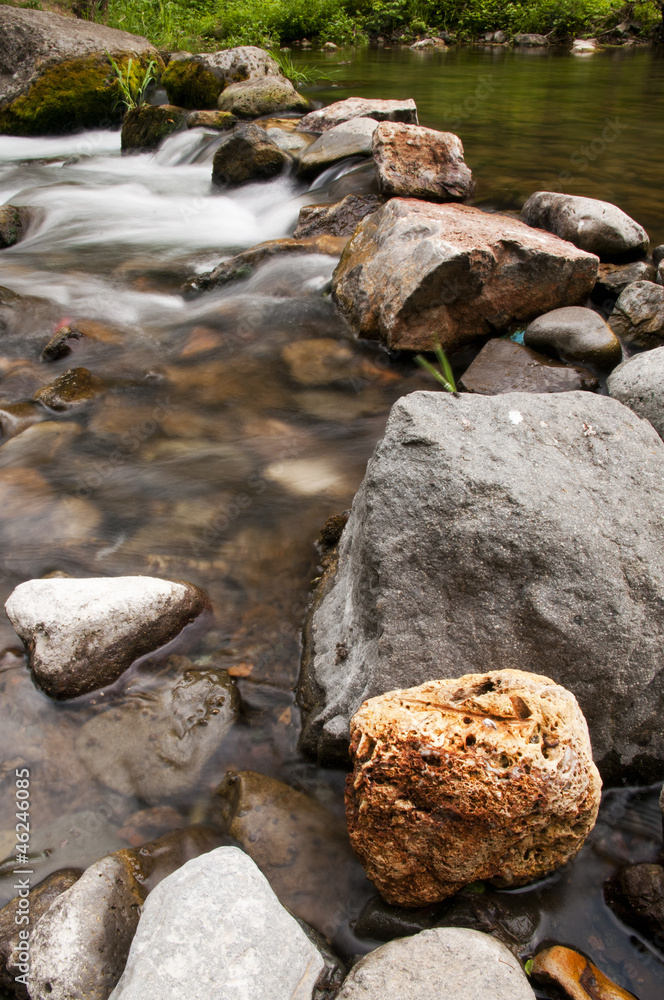 Natural bridge from the rocks in the mountain river Natural bridge from the rocks in the mountain river