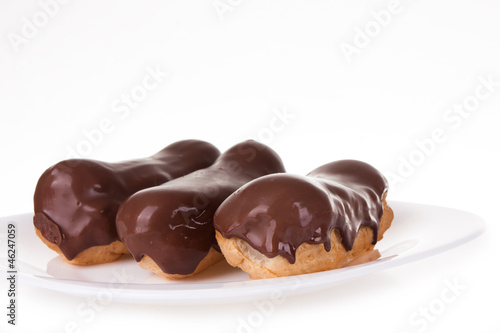 Eclairs on white plate