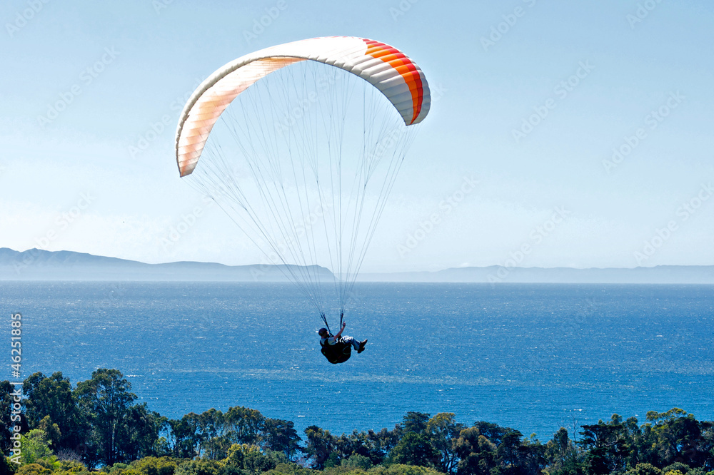 Paraglider above the Pacific Ocean Paraglider above the Pacific Ocean
