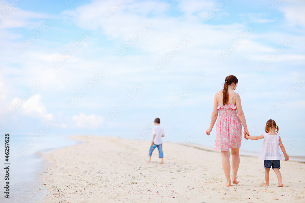 Mother and two kids on beach