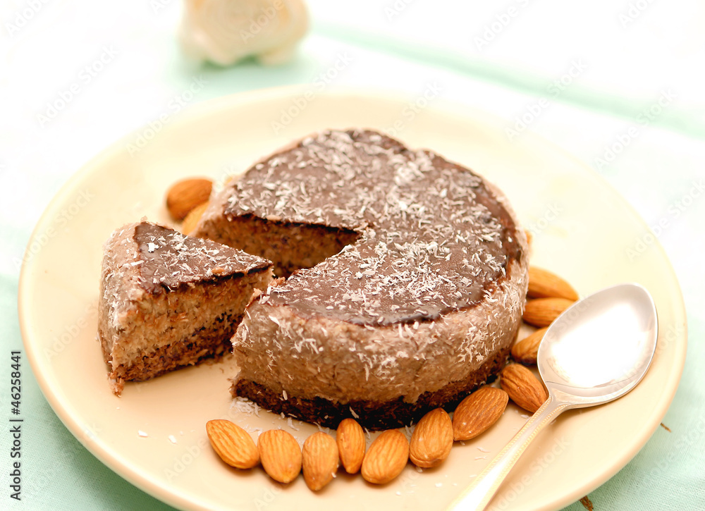 Raw vegan cake sliced on a dish Raw vegan cake sliced on a dish