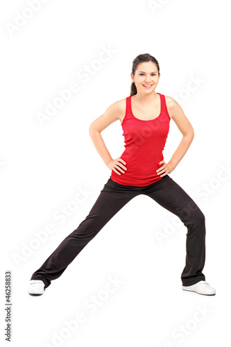 Full length portrait of a young athlete exercising