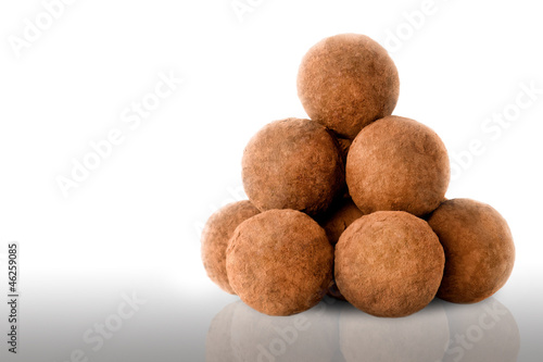 Chocolate truffles on white background