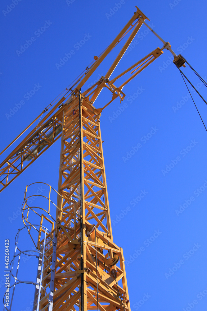 yellow crane with blue sky