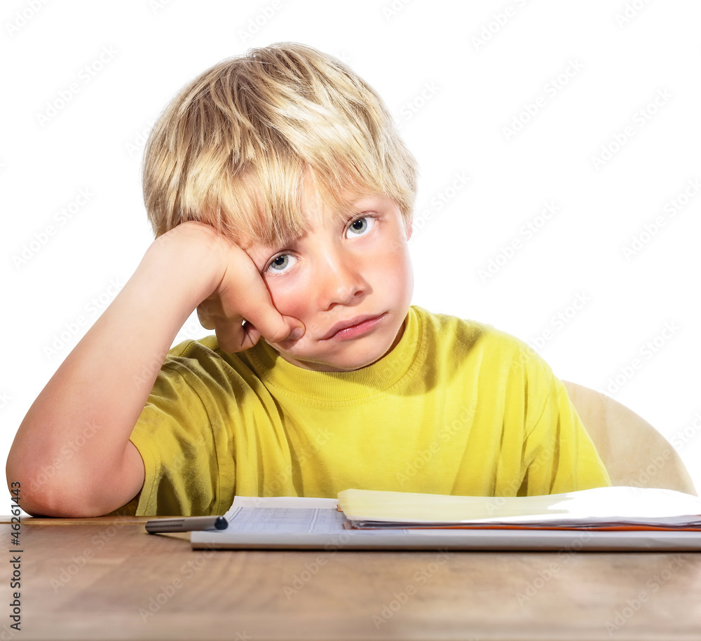 desperate boy doing his homework - isolated on white background desperate boy doing his homework - isolated on white background