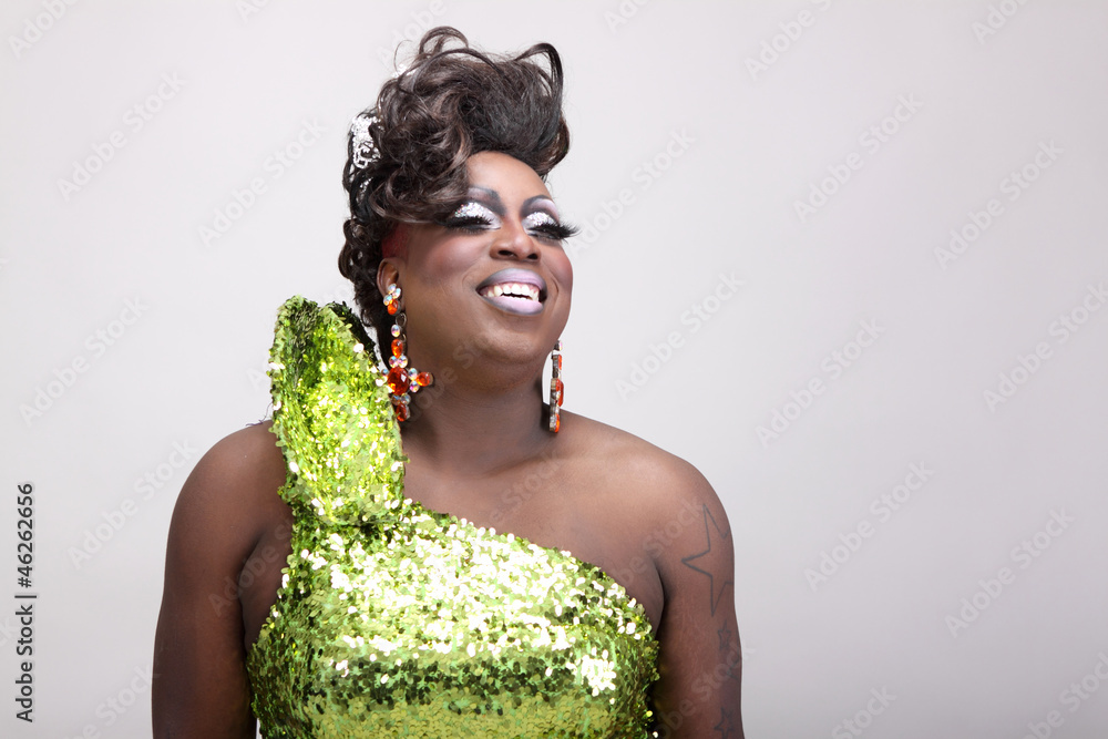 Drag queen wearing a green gown with sequins. - obrazy, fototapety, plakaty 