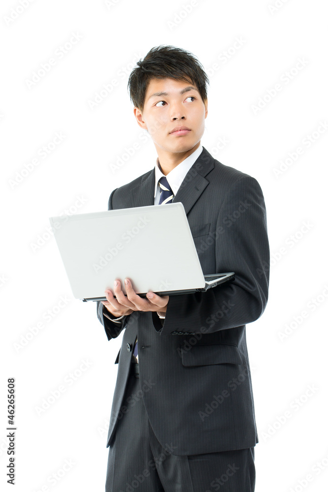Young asian businessman using a laptop computer Young asian businessman using a laptop computer