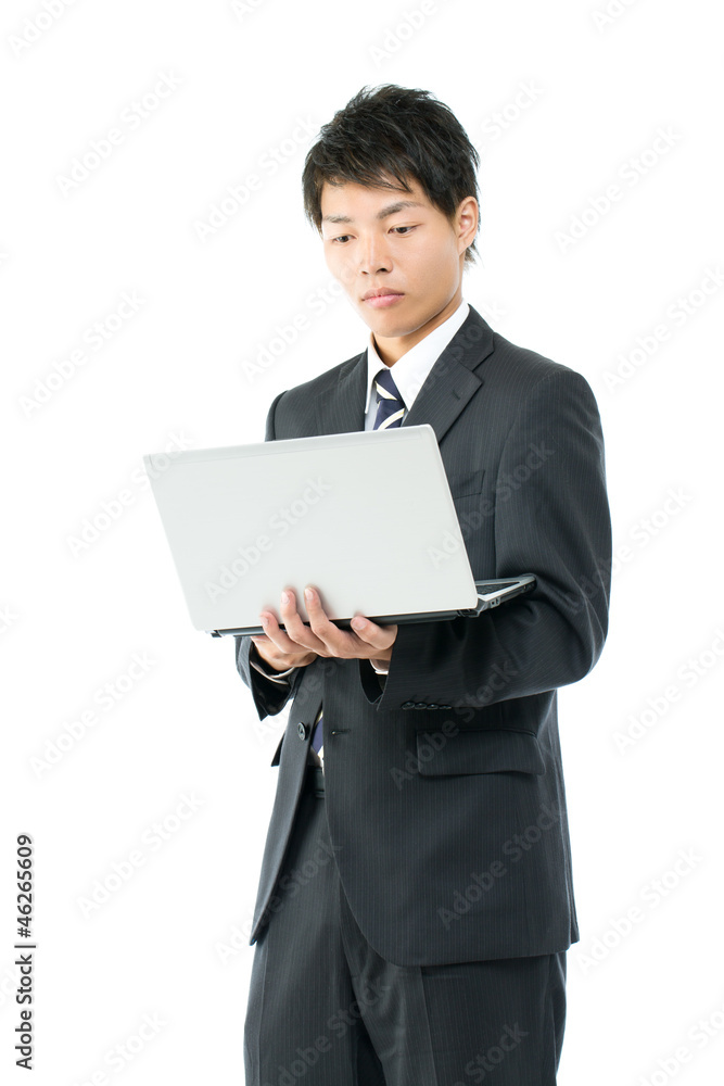 Young asian businessman using a laptop computer Young asian businessman using a laptop computer