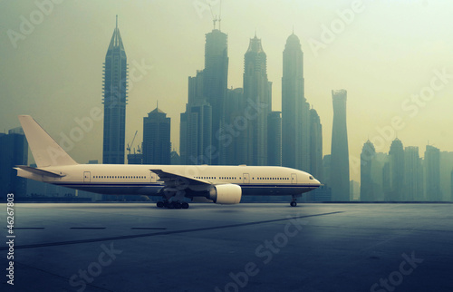 Canvas Print Airplane in front of a Skyline