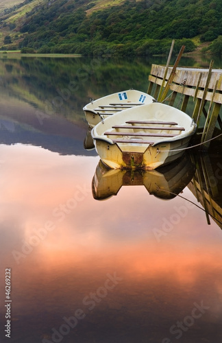 Rowing boats moored at jetty on Llyn Nantlle in Snowdonia Nation photo