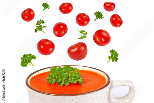 Tomato soup, herbs and tomatoes isolated on white
