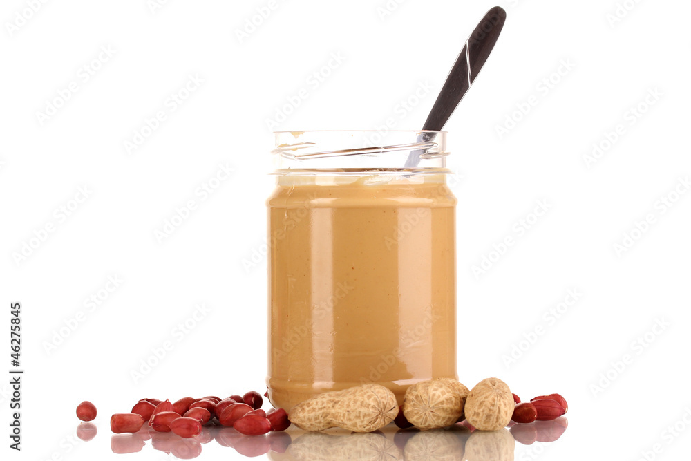 Delicious peanut butter in jar isolated on white Delicious peanut butter in jar isolated on white