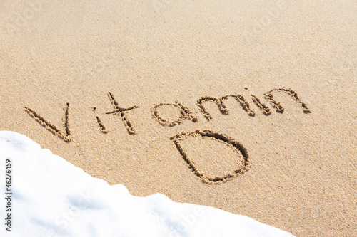 Vitamin D written in the sand