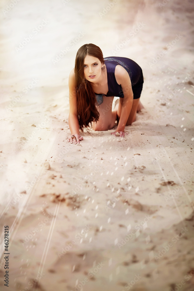 Fototapeta premium Sexual woman on the beach sand