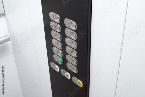 Elevator black control panel with silver metal buttons