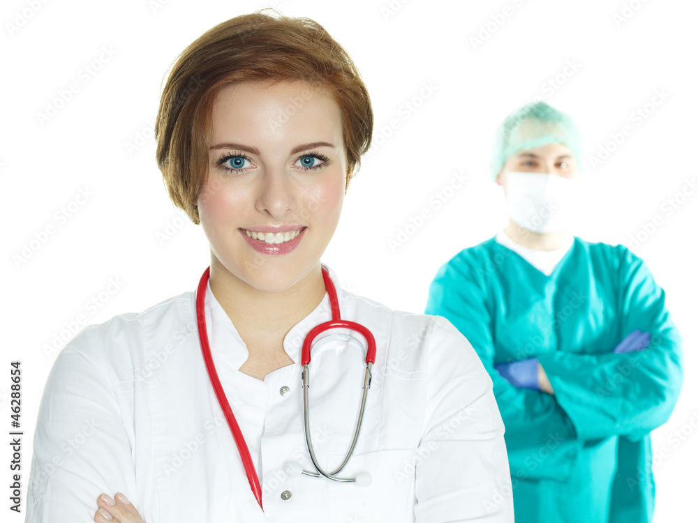 Female doctor in front of an operating surgeon Female doctor in front of an operating surgeon
