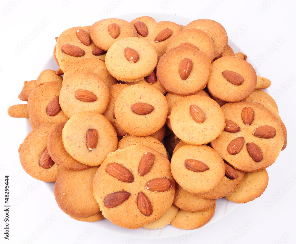 Naklejka premium Pile of almond cookies on white background