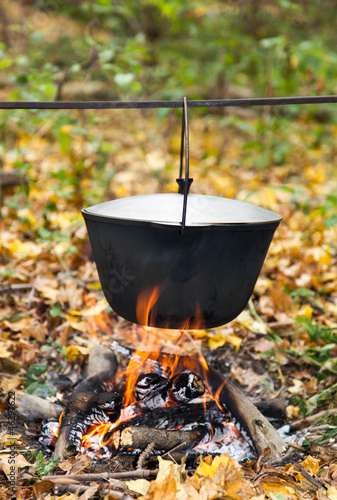 Preparing food on campfire