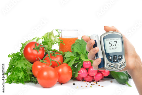 Diabetes concept glucometer and healthy food photo