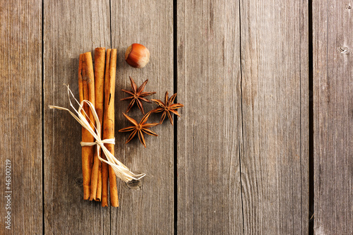 Cinnamon sticks over wooden table