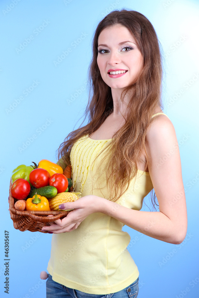 Beautiful woman with vegetables in wicker basket Beautiful woman with vegetables in wicker basket